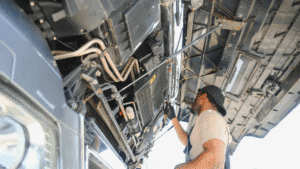 a diesel mechanic working on a piece of equipment
